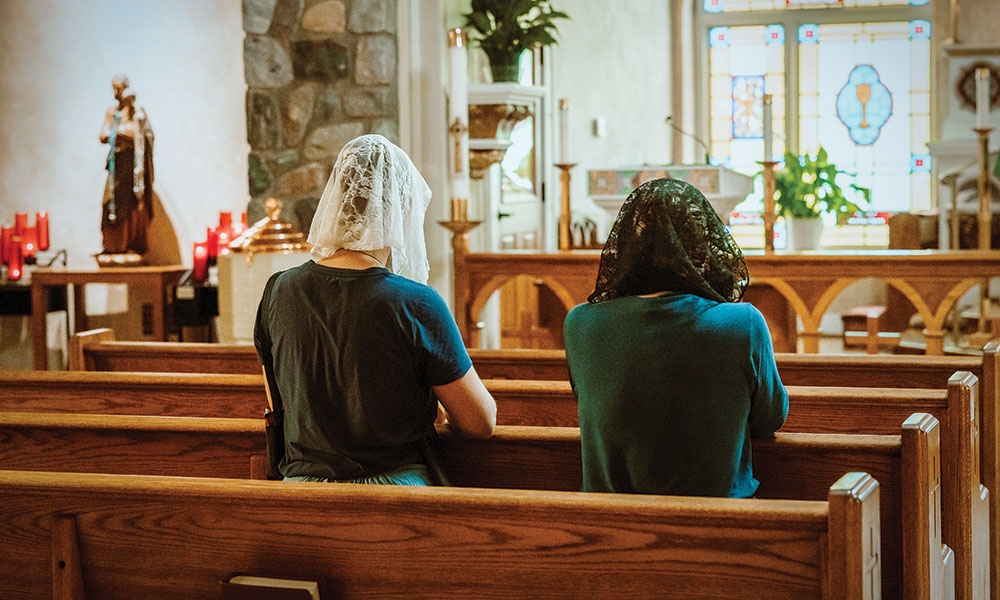 Mary and Kathleen Kossey kneel in prayer for the Blessed Sacrament at the St. Joseph Shrine in Brooklyn