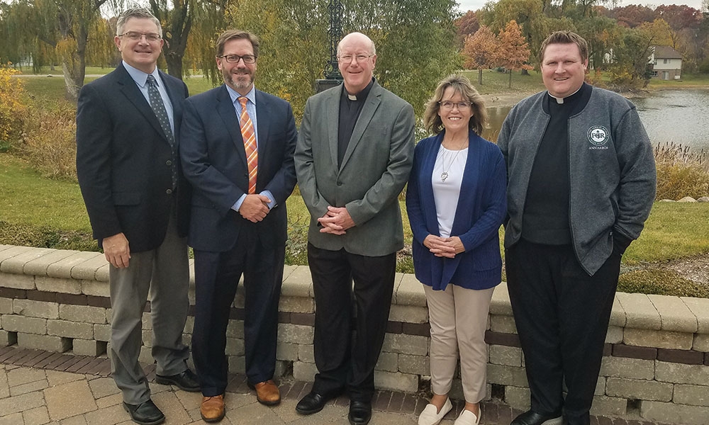 Right to Left – Fr. Ryan Riley, Pastor, St. Martha, Okemos, former auditor; Kathy Grisdela, Business Manager, St. Mary Magdalen, Brighton; Fr. Brendan Walsh, Pastor, St. Joseph, Dexter; George Landolt, Williamston, CFO, Diocese of Lansing; and Matt Hufnagel, Owosso, President, The Catholic Foundation.