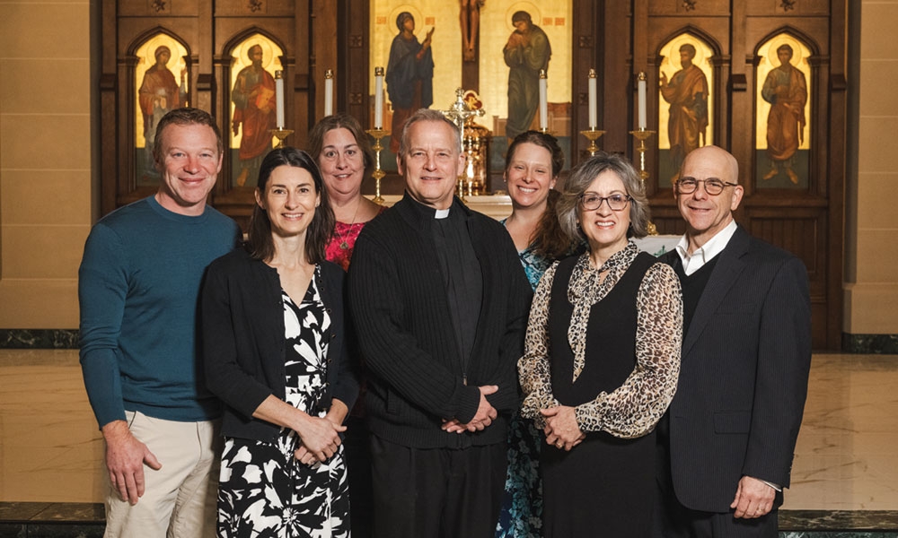 L to R Pete Kogut, Lisa Kogut, Debbie McPherson, Father Steve Mattson, Maureen Budd, Michelle Rivet, Ed Rivet