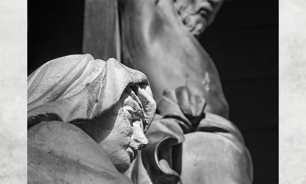 Black and white photo of Mary and Jesus crucified statues