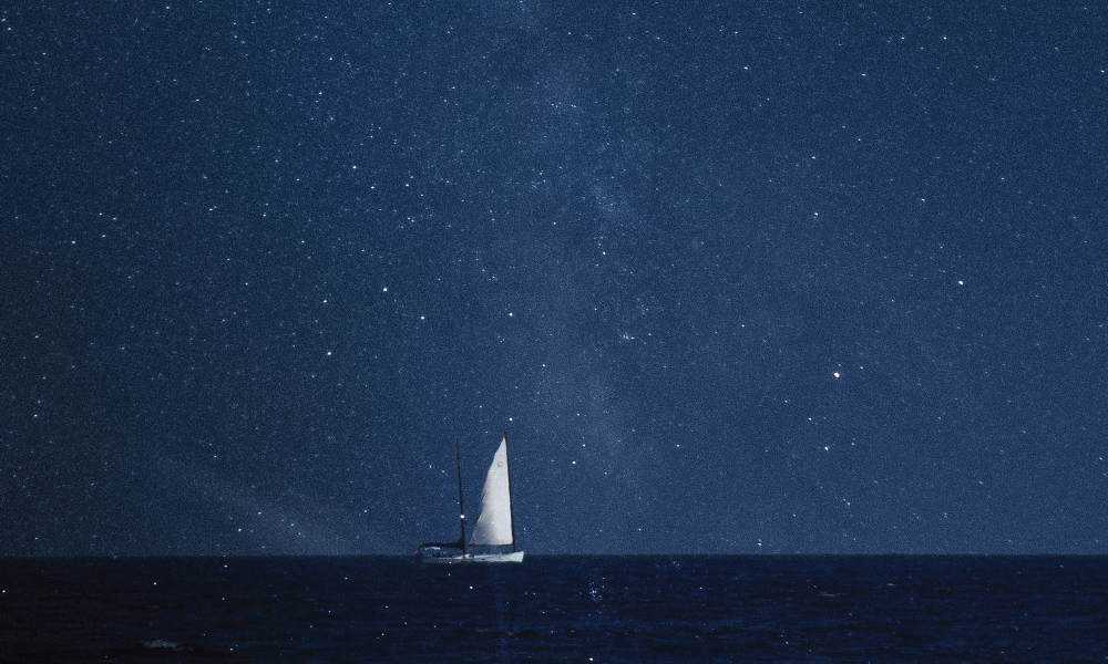 Sailboat out at sea at night